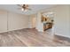 Open-concept living space with hardwood floors and neutral paint, seamlessly connected to the modern kitchen at 5322 Jocelyn Ln, Charlotte, NC 28269