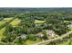 Serene aerial view of homes surrounded by lush greenery, offering a private, wooded setting at 5916 Cashion Rd, Huntersville, NC 28078