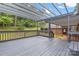 Inviting back deck with an overhead pergola that offers views of the property's backyard space at 5916 Cashion Rd, Huntersville, NC 28078