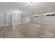 Spacious finished basement featuring recessed lighting, light wood floors, and built in shelving at 5916 Cashion Rd, Huntersville, NC 28078