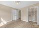 Bright bedroom with hardwood floors, neutral paint, closet, and white doors create a cozy and inviting space at 5916 Cashion Rd, Huntersville, NC 28078
