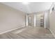 The neutral bedroom features a closet with sliding doors and a window for natural light at 5916 Cashion Rd, Huntersville, NC 28078