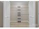 This organized walk-in closet features shelving and ample room for storage needs at 5916 Cashion Rd, Huntersville, NC 28078
