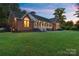 Charming brick home with a welcoming front porch and well-maintained landscaping at 5916 Cashion Rd, Huntersville, NC 28078