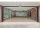 Spacious garage with storage shelving, ceiling fans and convenient access doors at 5916 Cashion Rd, Huntersville, NC 28078