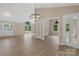 Spacious living room with vaulted ceilings, wood-look floors, and lots of natural light at 5916 Cashion Rd, Huntersville, NC 28078
