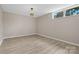 A well-lit bonus room features a window for natural light and neutral wall color at 5916 Cashion Rd, Huntersville, NC 28078