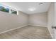 A bonus room with a window allowing for light and neutral paint at 5916 Cashion Rd, Huntersville, NC 28078