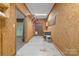 Unfinished storage space with shelving and work bench offering practical utility and potential at 5916 Cashion Rd, Huntersville, NC 28078