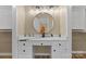 This walk-in closet has a dedicated vanity space, offering ample storage with a countertop and drawers at 5916 Cashion Rd, Huntersville, NC 28078