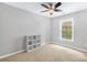 Neutral bedroom with a window, storage shelving, and wall-to-wall carpet at 622 Lorain Nw Ave, Concord, NC 28027