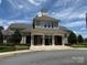 Attractive clubhouse exterior with stone accents, multiple windows, and welcoming entrance, nestled among landscaped greenery at 622 Lorain Nw Ave, Concord, NC 28027