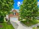 Charming home with brick accents, two-car garage, a long drive, and mature trees in a well-kept lawn at 622 Lorain Nw Ave, Concord, NC 28027
