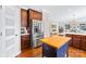 This modern kitchen features stainless steel appliances, granite countertops, and a butcher block island at 622 Lorain Nw Ave, Concord, NC 28027