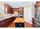 This bright kitchen features granite countertops, stainless steel appliances, and a convenient butcher block island at 622 Lorain Nw Ave, Concord, NC 28027