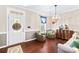 Cozy living room featuring hardwood floors, elegant decor, a decorative front door, and neutral wall paint at 622 Lorain Nw Ave, Concord, NC 28027