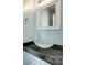 Stylish powder room featuring a unique glass vessel sink and a modern mirror at 672 Carybrook Ct, York, SC 29745
