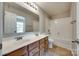 Well-lit bathroom featuring a double sink vanity and a shower-tub combination at 672 Carybrook Ct, York, SC 29745