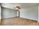 Large bedroom with hardwood floors, ceiling fan, and neutral paint at 672 Carybrook Ct, York, SC 29745