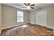 Bright bedroom boasts wood floors, fan, and double door closet at 672 Carybrook Ct, York, SC 29745