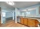 Functional kitchen area with stainless steel dishwasher, wood cabinets, and open view to the living space at 672 Carybrook Ct, York, SC 29745