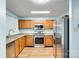 Well-equipped kitchen featuring stainless steel appliances, wood cabinets, and laminate countertops at 672 Carybrook Ct, York, SC 29745