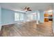 Open living space with hardwood floors, view of the kitchen, and a doorway leading outside at 672 Carybrook Ct, York, SC 29745