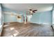 Spacious living room with hardwood floors, view to kitchen, and stairs to another level at 672 Carybrook Ct, York, SC 29745