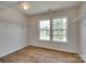 Walk-in closet with laminate wood floor and natural light at 672 Carybrook Ct, York, SC 29745