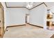 This spacious living room offers neutral walls, carpet, and trim, plus an adjacent kitchen at 704 Colby Cir, Salisbury, NC 28147