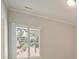 Bedroom featuring neutral walls and window with plantation shutters at 7319 Stonehaven Dr, Waxhaw, NC 28173