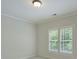 Bedroom featuring neutral walls, carpet flooring, and natural light from the window at 7319 Stonehaven Dr, Waxhaw, NC 28173