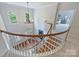 Elegant foyer with hardwood floors, a grand staircase, a chandelier, and lots of natural light at 7319 Stonehaven Dr, Waxhaw, NC 28173