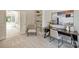 Bright home office with built-in shelves and a modern desk at 7319 Stonehaven Dr, Waxhaw, NC 28173