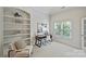 Home office with built-in shelves and a large window providing lots of natural light at 7319 Stonehaven Dr, Waxhaw, NC 28173