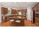 Gourmet kitchen featuring stainless appliances, central island, and ample wood cabinetry at 7319 Stonehaven Dr, Waxhaw, NC 28173