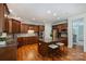 Stylish kitchen with wood cabinetry, granite countertops, stainless steel appliances, and central island seating at 7319 Stonehaven Dr, Waxhaw, NC 28173