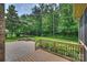 Backyard patio with seating area, fire pit, manicured lawn and lush landscaping at 7319 Stonehaven Dr, Waxhaw, NC 28173
