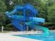 Community pool area featuring a large water slide, perfect for summertime fun and recreation at 7319 Stonehaven Dr, Waxhaw, NC 28173