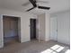 Comfortable bedroom showcases neutral walls, ceiling fan, and multiple entryways at 7323 Jane Parks Way, Charlotte, NC 28217