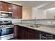 Granite countertops, stainless appliances, and modern finishes define the kitchen space at 7323 Jane Parks Way, Charlotte, NC 28217