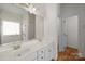 Bright bathroom with double sinks, gold fixtures, and a large window with a shower at 765 Portpatrick Pl, Fort Mill, SC 29708