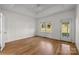 Bedroom featuring hardwood floors, a ceiling fan, and neutral paint at 765 Portpatrick Pl, Fort Mill, SC 29708