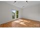 Bright bedroom with natural light, hardwood floors and track lighting at 765 Portpatrick Pl, Fort Mill, SC 29708