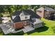 Aerial exterior view of a brick home with a screened porch and well-maintained lawn at 765 Portpatrick Pl, Fort Mill, SC 29708
