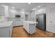 Bright kitchen with island, stainless steel appliances, and ample counter space at 765 Portpatrick Pl, Fort Mill, SC 29708
