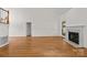 Spacious living room featuring a fireplace and hardwood floors at 765 Portpatrick Pl, Fort Mill, SC 29708