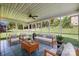 Relaxing screened porch featuring comfortable seating, greenery and bright, natural light at 765 Portpatrick Pl, Fort Mill, SC 29708