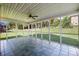 A spacious screened porch with blue tile floors offers an open view of the backyard at 765 Portpatrick Pl, Fort Mill, SC 29708