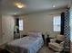 Cozy bedroom with soft carpet, natural light, and modern black-out curtains at 9142 Widden Way, Charlotte, NC 28269